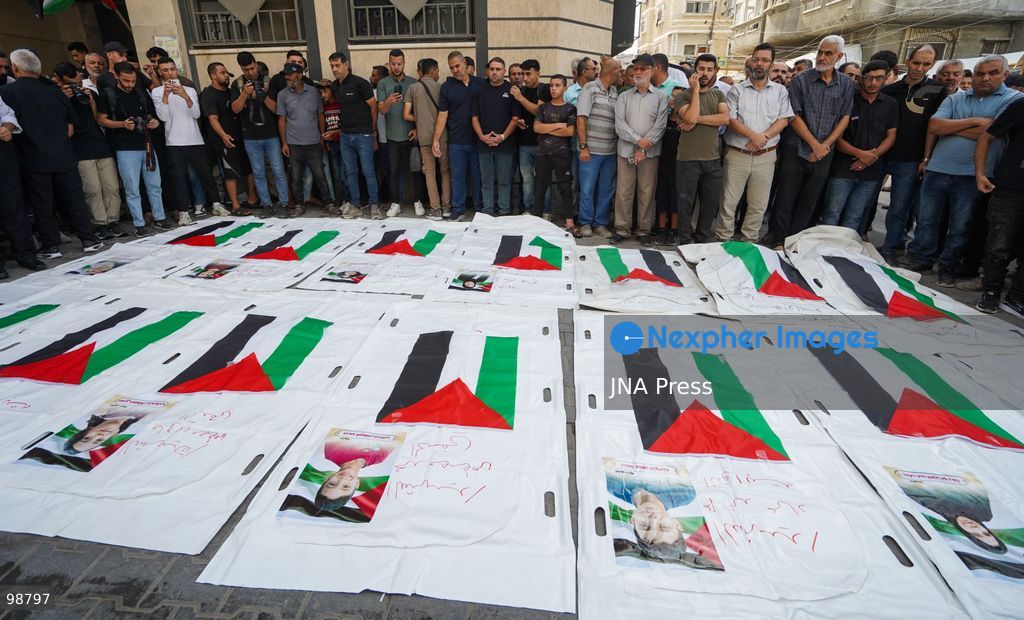 NUSEIRAT, GAZA STRIP, SEPTEMBER 29, 2026: Palestinians mourn during funeral ceremonies for victims whose remains were recovered from beneath the rubble of Al-Muhandisin Tower and other destroyed homes in the Nuseirat refugee camp in the central Gaza Strip. Recovery teams have been searching through the ruins of Al-Muhandisin Tower, which was destroyed during the war, as families prepare to bury relatives whose remains had been trapped beneath the rubble for an extended period. Photo by Ramzi Abu Amer / JNA Press. (Photo by Ramzi Abu Amer/JNA Press via Nexpher Images)