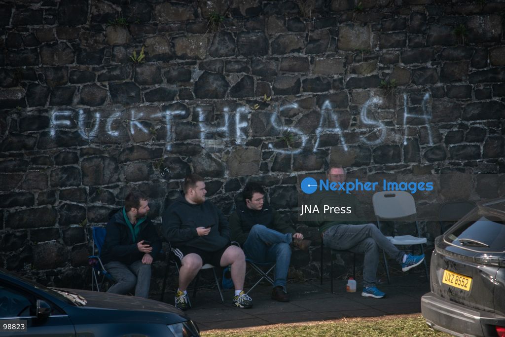 PORTADOWN, NORTHERN IRELAND, SEPTEMBER 28, 2026: Members of the Orange Order gather near Drumcree Parish Church as a standoff over the contentious Drumcree parade continues in Portadown. The Protestant fraternal organization had been granted conditional permission to march along the predominantly nationalist Garvaghy Road for the first time in nearly three decades, but the route was blocked by thousands of protesters and police prevented the parade from proceeding amid public safety concerns. On Monday, residents continued gathering on Garvaghy Road while Orange Order members remained near Drumcree Church as discussions continued with police and officials over the dispute. Photo by Nadia Caimi / JNA Press. (Photo by Nadia Caimi/JNA Press via Nexpher Images)