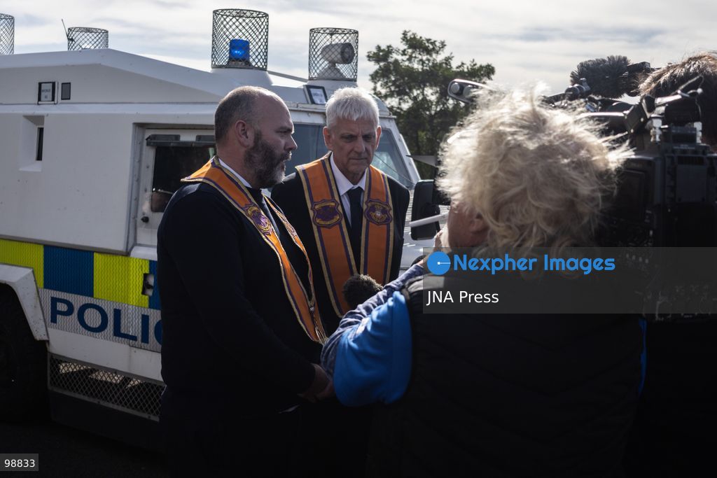PORTADOWN, NORTHERN IRELAND, SEPTEMBER 28, 2026: Members of the Orange Order gather near Drumcree Parish Church as a standoff over the contentious Drumcree parade continues in Portadown. The Protestant fraternal organization had been granted conditional permission to march along the predominantly nationalist Garvaghy Road for the first time in nearly three decades, but the route was blocked by thousands of protesters and police prevented the parade from proceeding amid public safety concerns. On Monday, residents continued gathering on Garvaghy Road while Orange Order members remained near Drumcree Church as discussions continued with police and officials over the dispute. Photo by Nadia Caimi / JNA Press. (Photo by Nadia Caimi/JNA Press via Nexpher Images)