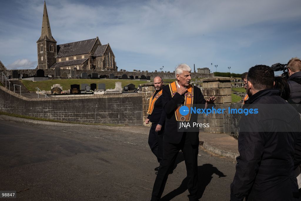 PORTADOWN, NORTHERN IRELAND, SEPTEMBER 28, 2026: Members of the Orange Order gather near Drumcree Parish Church as a standoff over the contentious Drumcree parade continues in Portadown. The Protestant fraternal organization had been granted conditional permission to march along the predominantly nationalist Garvaghy Road for the first time in nearly three decades, but the route was blocked by thousands of protesters and police prevented the parade from proceeding amid public safety concerns. On Monday, residents continued gathering on Garvaghy Road while Orange Order members remained near Drumcree Church as discussions continued with police and officials over the dispute. Photo by Nadia Caimi / JNA Press. (Photo by Nadia Caimi/JNA Press via Nexpher Images)