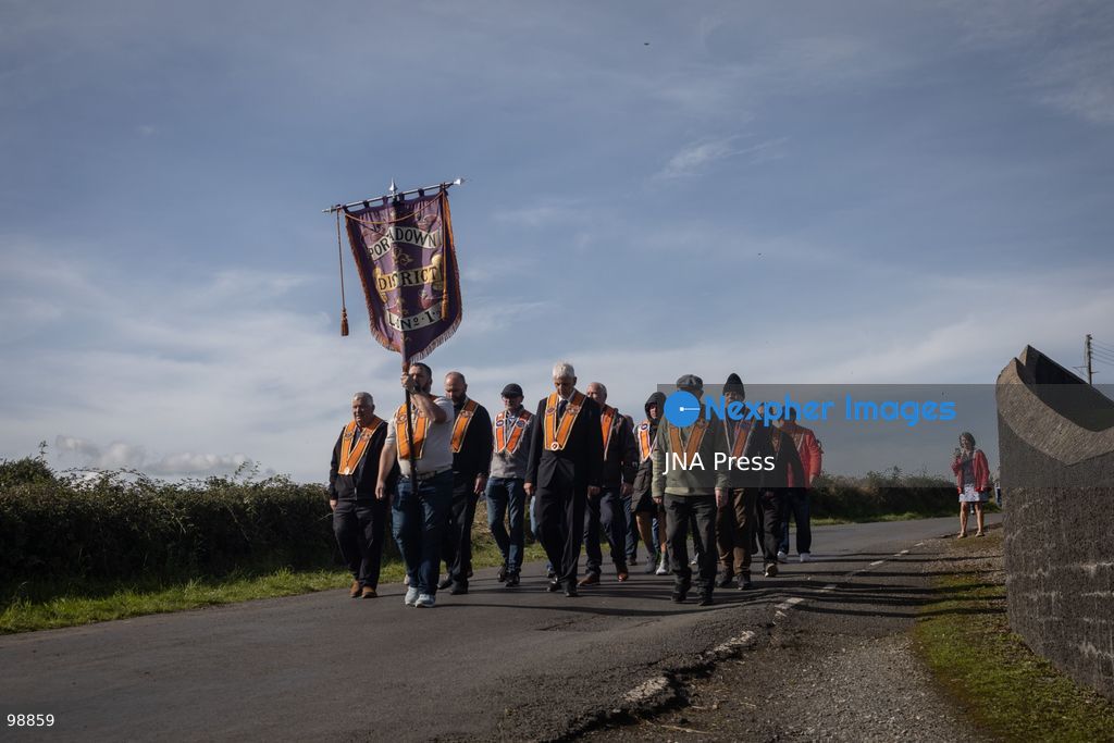 PORTADOWN, NORTHERN IRELAND, SEPTEMBER 28, 2026: Members of the Orange Order gather near Drumcree Parish Church as a standoff over the contentious Drumcree parade continues in Portadown. The Protestant fraternal organization had been granted conditional permission to march along the predominantly nationalist Garvaghy Road for the first time in nearly three decades, but the route was blocked by thousands of protesters and police prevented the parade from proceeding amid public safety concerns. On Monday, residents continued gathering on Garvaghy Road while Orange Order members remained near Drumcree Church as discussions continued with police and officials over the dispute. Photo by Nadia Caimi / JNA Press. (Photo by Nadia Caimi/JNA Press via Nexpher Images)
