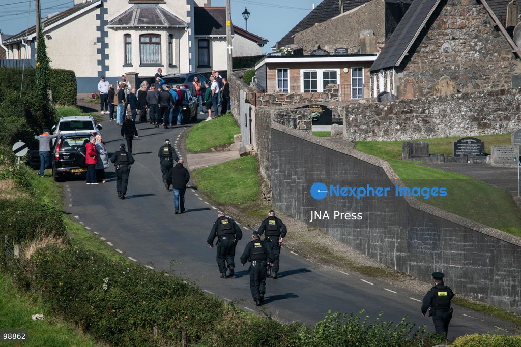 PORTADOWN, NORTHERN IRELAND, SEPTEMBER 28, 2026: Members of the Orange Order gather near Drumcree Parish Church as a standoff over the contentious Drumcree parade continues in Portadown. The Protestant fraternal organization had been granted conditional permission to march along the predominantly nationalist Garvaghy Road for the first time in nearly three decades, but the route was blocked by thousands of protesters and police prevented the parade from proceeding amid public safety concerns. On Monday, residents continued gathering on Garvaghy Road while Orange Order members remained near Drumcree Church as discussions continued with police and officials over the dispute. Photo by Nadia Caimi / JNA Press. (Photo by Nadia Caimi/JNA Press via Nexpher Images)