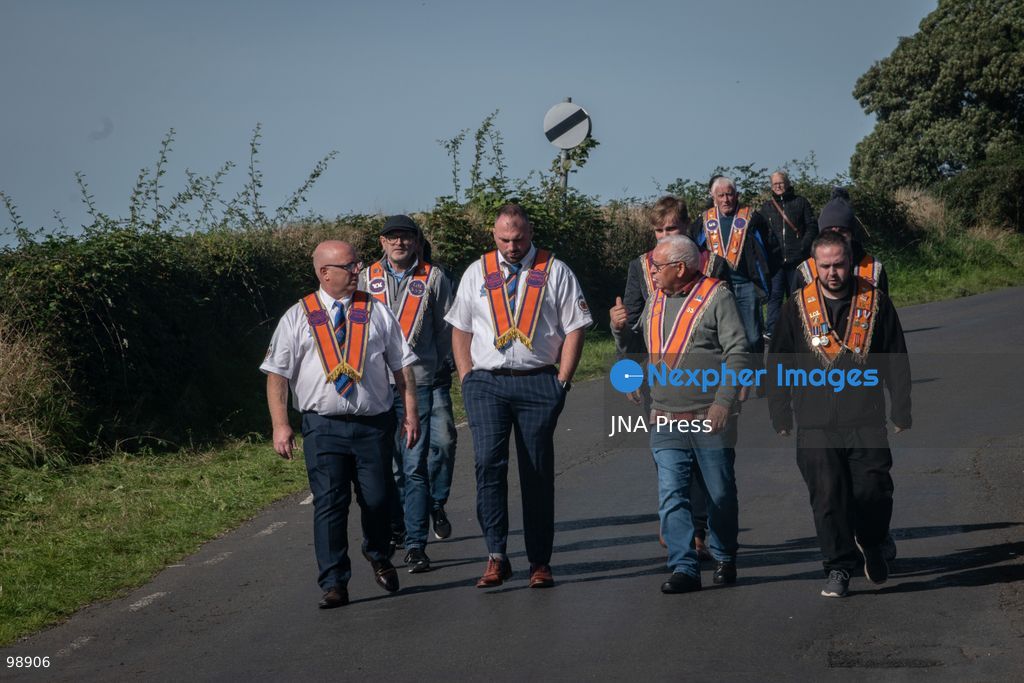PORTADOWN, NORTHERN IRELAND, SEPTEMBER 28, 2026: Members of the Orange Order gather near Drumcree Parish Church as a standoff over the contentious Drumcree parade continues in Portadown. The Protestant fraternal organization had been granted conditional permission to march along the predominantly nationalist Garvaghy Road for the first time in nearly three decades, but the route was blocked by thousands of protesters and police prevented the parade from proceeding amid public safety concerns. On Monday, residents continued gathering on Garvaghy Road while Orange Order members remained near Drumcree Church as discussions continued with police and officials over the dispute. Photo by Nadia Caimi / JNA Press. (Photo by Nadia Caimi/JNA Press via Nexpher Images)