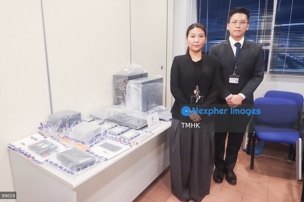 Chief Inspector Ng Yuk-pui of the Sha Tin District Crime Investigation Team and colleagues pose beside seized evidence, including retrieved pinhole cameras and adhesive materials, during a media photocall on September 28, 2026 in Hong Kong. The exhibits were confiscated following the arrest of a 34-year-old man accused of placing covert surveillance devices inside changing rooms at a fitness club in Lek Yuen. (Photo by Gordon Choi/TMHK via Nexpher Images)