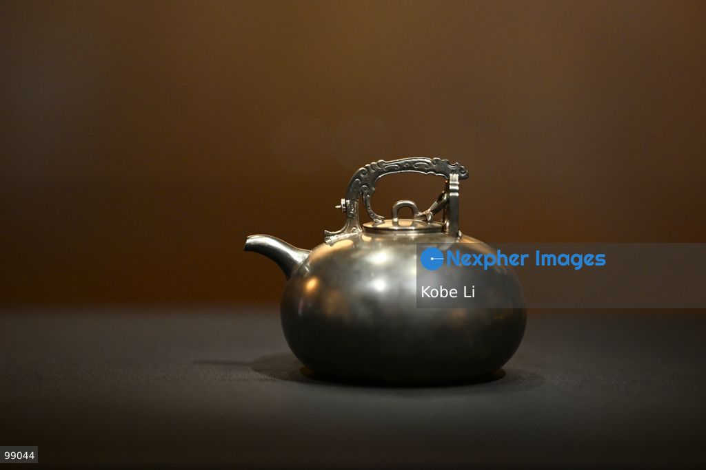Teapot with an overhead handle from the Palace Museum's 'Design for the Forbidden City: Imperial Workshops of the Qing Court' exhibition is displaying on September 29 in Hong Kong. (Photo by Kobe Li/Nexpher Images)