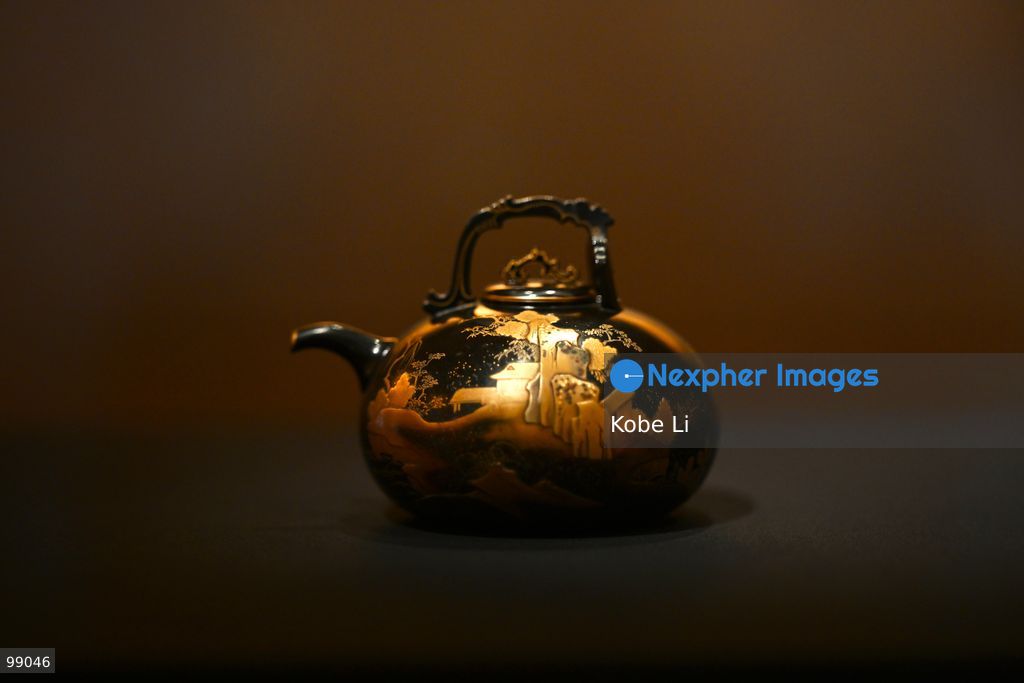 Black-lacquered teapot with decoration in gold tracing from the Palace Museum's 'Design for the Forbidden City: Imperial Workshops of the Qing Court' exhibition is displaying on September 29 in Hong Kong. (Photo by Kobe Li/Nexpher Images)