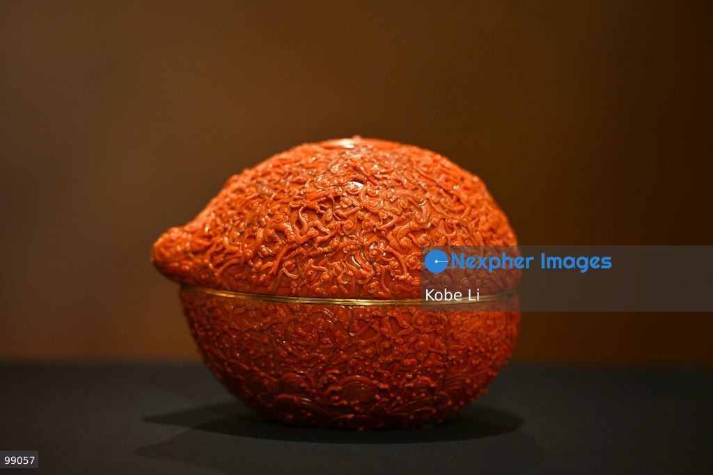 Peach-shaped box with dragons, clouds, waves, and “shou” (longevity) character from the Palace Museum's 'Design for the Forbidden City: Imperial Workshops of the Qing Court' exhibition is displaying on September 29 in Hong Kong. (Photo by Kobe Li/Nexpher Images)