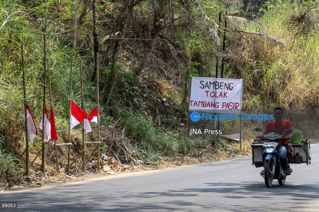 MAGELANG, CENTRAL JAVA, INDONESIA, SEPTEMBER 29, 2026: Indonesian flags fly at half-mast along a road in Sambeng Village, Borobudur, as residents stage a symbolic protest against sand mining activities in the Progo River. Local residents say the mining threatens water sources and could damage the surrounding environment. Photo by Ilham Nur Arifin / JNA Press. (Photo by Ilham Nur Arifin/JNA Press via Nexpher Images)