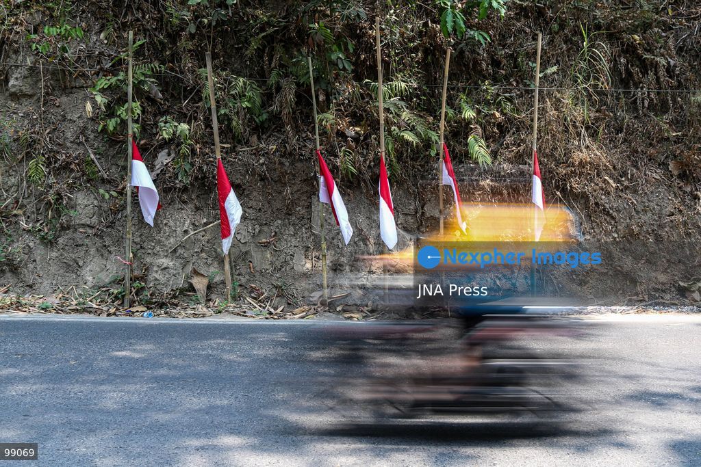 MAGELANG, CENTRAL JAVA, INDONESIA, SEPTEMBER 29, 2026: Indonesian flags fly at half-mast along a road in Sambeng Village, Borobudur, as residents stage a symbolic protest against sand mining activities in the Progo River. Local residents say the mining threatens water sources and could damage the surrounding environment. Photo by Ilham Nur Arifin / JNA Press. (Photo by Ilham Nur Arifin/JNA Press via Nexpher Images)
