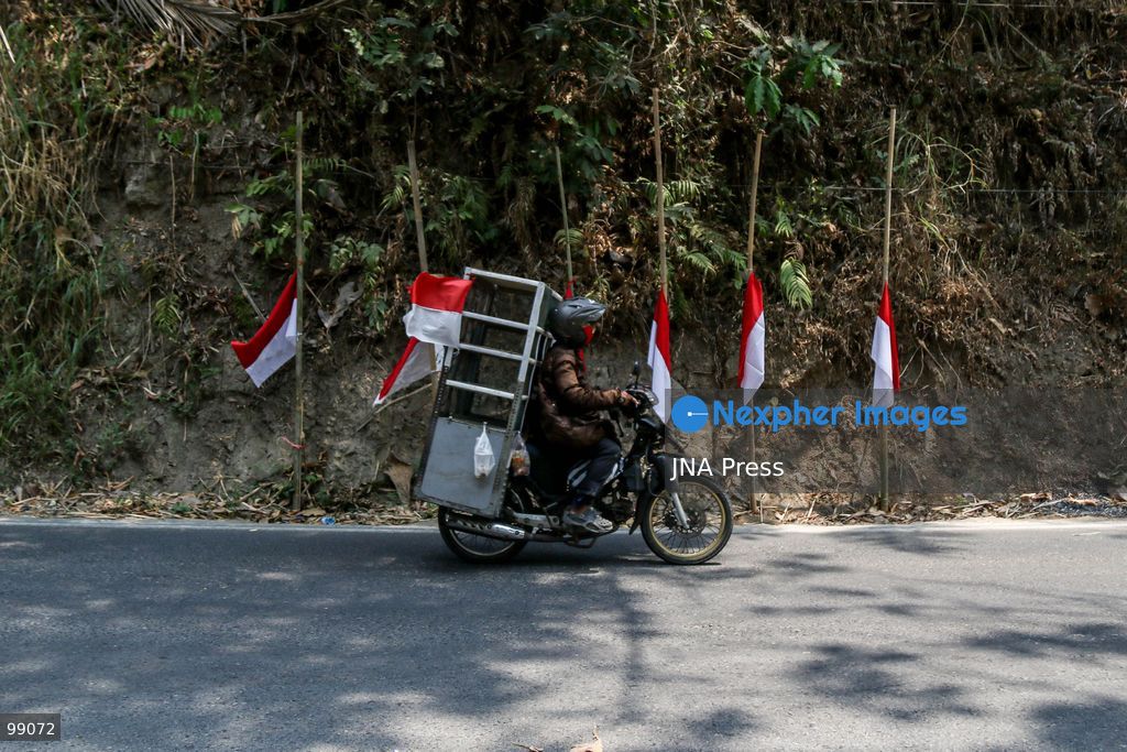 MAGELANG, CENTRAL JAVA, INDONESIA, SEPTEMBER 29, 2026: Indonesian flags fly at half-mast along a road in Sambeng Village, Borobudur, as residents stage a symbolic protest against sand mining activities in the Progo River. Local residents say the mining threatens water sources and could damage the surrounding environment. Photo by Ilham Nur Arifin / JNA Press. (Photo by Ilham Nur Arifin/JNA Press via Nexpher Images)