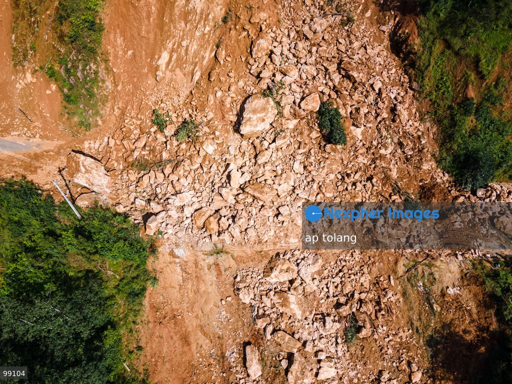 LALITPUR, NEPAL, SEPTEMBER 29, 2026: An aerial view shows a landslide blocking the Tikabhairab section of the Kanti Highway in Lalitpur following heavy rainfall. The landslide covered the roadway with mud and debris, disrupting traffic along the route. (Photo by ap tolang/Nexpher Images)