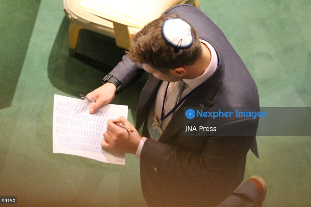 NEW YORK, UNITED STATES, SEPTEMBER 24, 2026: A member of the Israeli delegation walks through the General Assembly Hall while taking notes and carrying a seating chart as Israeli Prime Minister Benjamin Netanyahu addresses the General Debate of the 81st Session of the United Nations General Assembly at UN headquarters in New York. Photo by Catherine Manso / JNA Press. (Photo by Catherine Manso/JNA Press via Nexpher Images)