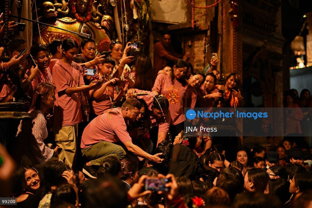 KATHMANDU, NEPAL, SEPTEMBER 29, 2026: Women pull the chariots carrying Kathmandu’s three living deities during Nanicha Ya, the final-day procession of the week-long Indra Jatra festival around Hanumandhoka and Kathmandu Durbar Square. Unlike the preceding chariot processions, traditionally led by men, Nanicha Ya marks the festival tradition in which women take over the pulling of the chariots carrying Royal Living Goddess Kumari Aryatara Shakya, Living God Ganesh and Living God Bhairav. Nepalese President Ram Chandra Paudel attended the concluding ceremonies at Hanumandhoka, receiving tika and prasad from the Kumari. The final-day celebrations also included traditional music, Dashavatar performances, members of the Nepali Army’s Gurju Paltan and religious rituals as devotees gathered to mark the conclusion of Indra Jatra. Photo by Safal Prakash Shrestha / JNA Press. (Photo by Safal Prakash Shrestha/JNA Press via Nexpher Images)