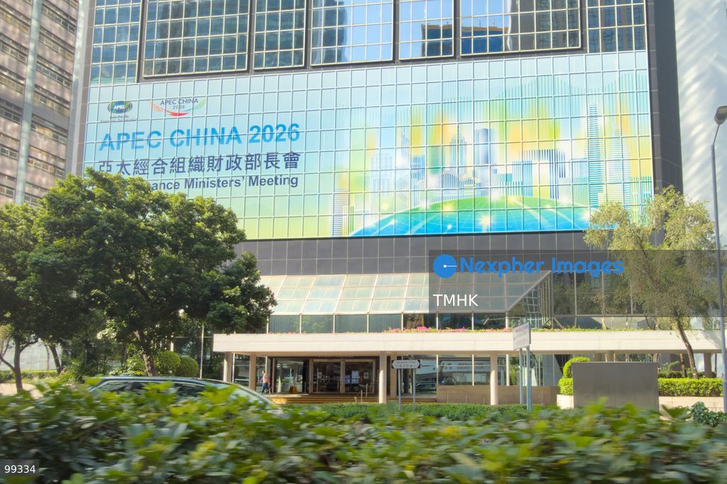 A giant banner promoting the upcoming "APEC China 2026" APEC Finance Ministers' Meeting is displayed across the exterior facade of Revenue Tower in Wan Chai on September 29, 2026 in Hong Kong, highlighting the city's engagements and preparations ahead of regional economic dialogues under the APEC framework. (Photo by Kevin Li/TMHK via Nexpher Images)