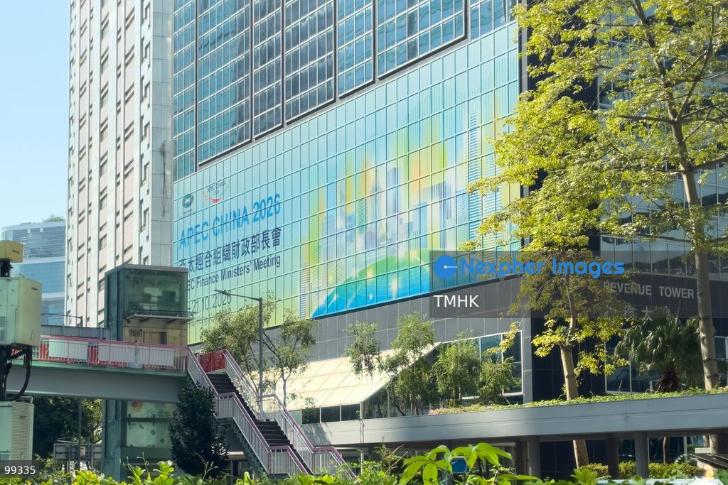 A giant banner promoting the upcoming "APEC China 2026" APEC Finance Ministers' Meeting is displayed across the exterior facade of Revenue Tower in Wan Chai on September 29, 2026 in Hong Kong, highlighting the city's engagements and preparations ahead of regional economic dialogues under the APEC framework. (Photo by Kevin Li/TMHK via Nexpher Images)