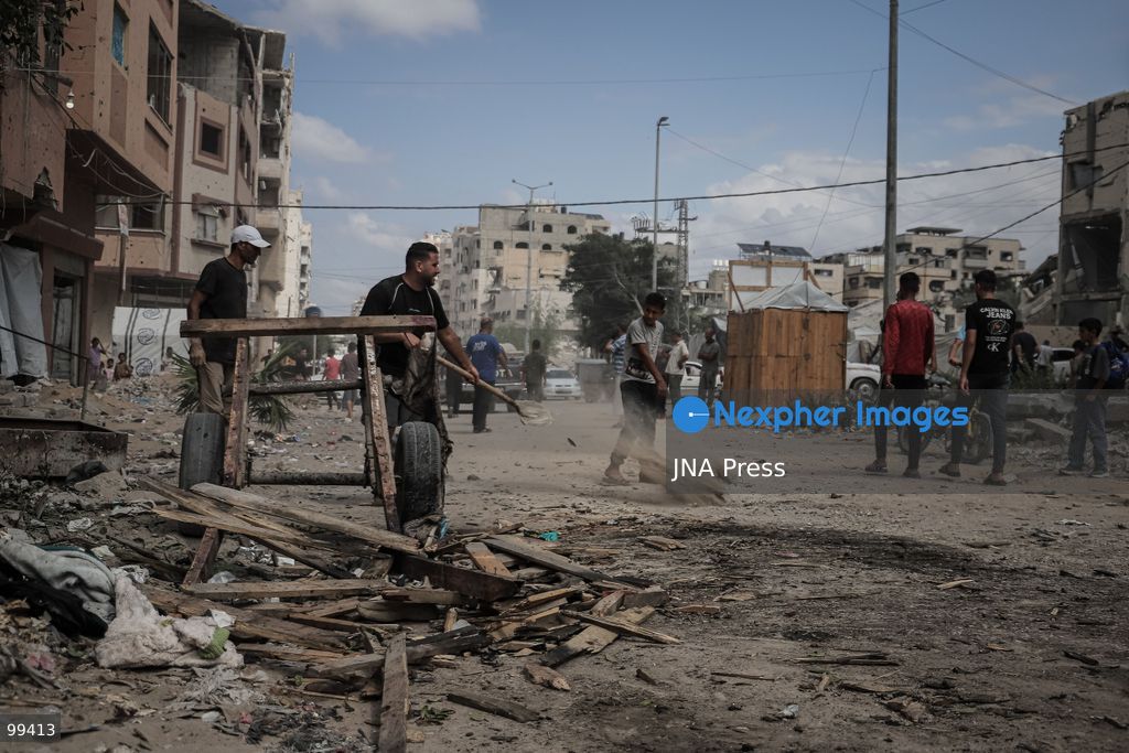 GAZA CITY, GAZA STRIP, SEPTEMBER 30, 2026: Palestinians gather at the scene after an Israeli airstrike targeted a vehicle in the Tel al-Hawa neighborhood of Gaza City. Five Palestinians were killed and 13 others injured in the strike, according to the Palestinian Red Crescent Society, which said its crews transported the dead to Al-Shifa Hospital and the wounded to Al-Quds Hospital. The Israeli military had not immediately commented on the strike. Photo by Mohammed M. Skaik / JNA Press. (Photo by Mohammed M Skaik/JNA Press via Nexpher Images)