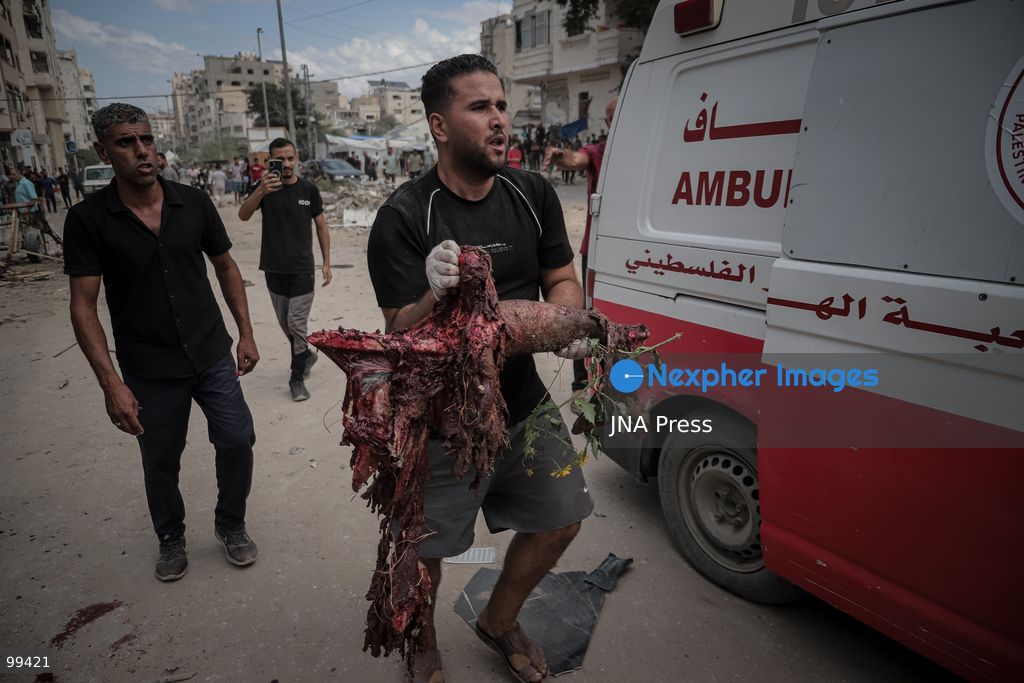 GAZA CITY, GAZA STRIP, SEPTEMBER 30, 2026: Palestinians gather at the scene after an Israeli airstrike targeted a vehicle in the Tel al-Hawa neighborhood of Gaza City. Five Palestinians were killed and 13 others injured in the strike, according to the Palestinian Red Crescent Society, which said its crews transported the dead to Al-Shifa Hospital and the wounded to Al-Quds Hospital. The Israeli military had not immediately commented on the strike. Photo by Mohammed M. Skaik / JNA Press. (Photo by Mohammed M Skaik/JNA Press via Nexpher Images)
