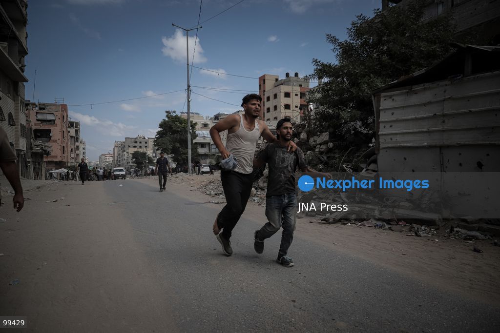 GAZA CITY, GAZA STRIP, SEPTEMBER 30, 2026: Palestinians gather at the scene after an Israeli airstrike targeted a vehicle in the Tel al-Hawa neighborhood of Gaza City. Five Palestinians were killed and 13 others injured in the strike, according to the Palestinian Red Crescent Society, which said its crews transported the dead to Al-Shifa Hospital and the wounded to Al-Quds Hospital. The Israeli military had not immediately commented on the strike. Photo by Mohammed M. Skaik / JNA Press. (Photo by Mohammed M Skaik/JNA Press via Nexpher Images)