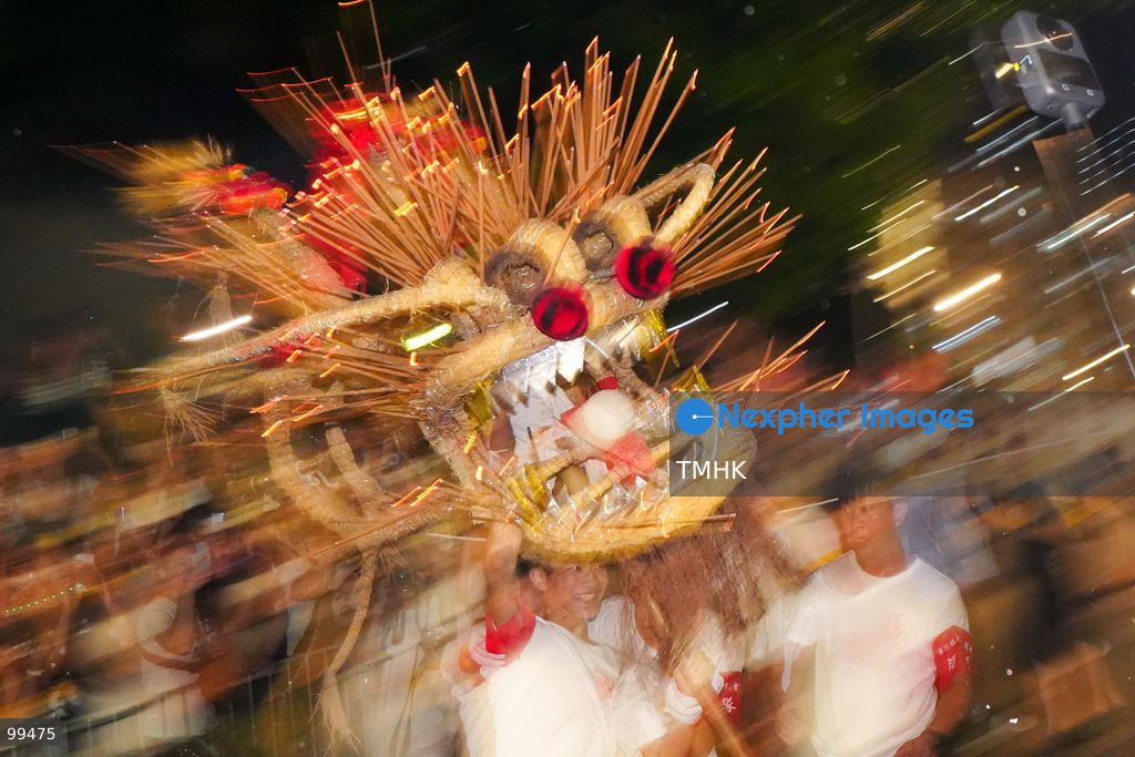 TOP PICS - The incense-laden fire dragon weaves through public corridors and plazas of Wah Fu Estate on September 25, 2026 in Hong Kong, surrounded by dense crowds of neighbourhood residents cheering from walkways and balconies ahead of the estate's planned redevelopment. (Photo by Zulu Lo/TMHK via Nexpher Images)
