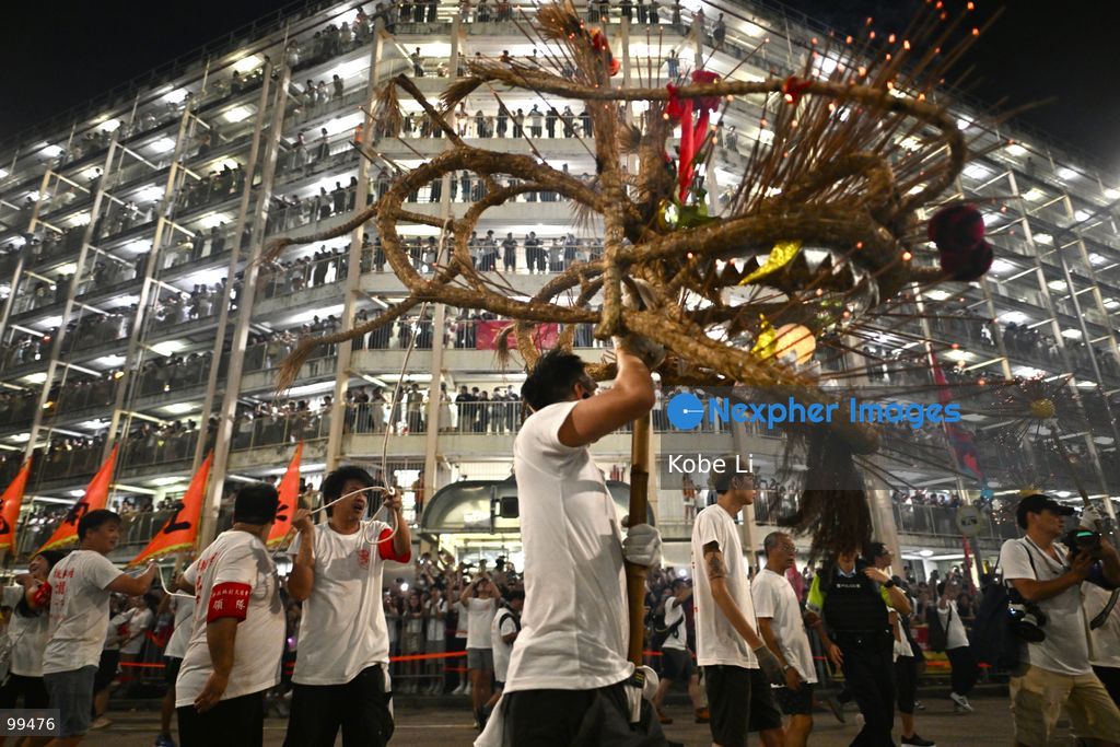 TOP PICS - Performers performing the fire dragon dance in Wah Fu Estate at Mid-autumn Festival on September 25, 2026 in Hong Kong. (Photo by Kobe Li/Nexpher Images)