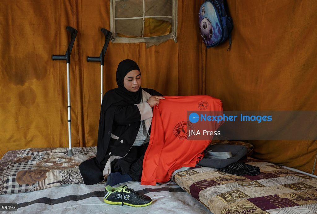 NUSEIRAT, GAZA STRIP, SEPTEMBER 30, 2026: Sixteen-year-old Malak al-Ghoul trains and plays football while living displaced with her family in the Nuseirat refugee camp in the central Gaza Strip. Malak lost her right leg after her family's home in Hamad City was struck on March 2, 2024. Now living with her family of 10 in Nuseirat, she continues to pursue her passion for sport and plays with Palestine's amputee football team, determined to continue training and pursue her ambitions despite her injury and displacement. Photo by Ramzi Abu Amer / JNA Press. (Photo by Ramzi Abu Amer/JNA Press via Nexpher Images)