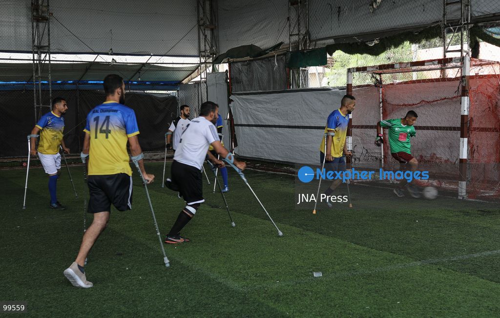 CENTRAL GAZA STRIP, SEPTEMBER 30, 2026: Palestinian amputee athletes take part in a football match in the central Gaza Strip as part of a humanitarian initiative supporting athletes who lost limbs during the war. The initiative aims to promote social inclusion and provide participants with an opportunity to return to sporting activities and rebuild their connection with everyday life through football. Photo by Ramzi Abu Amer / JNA Press (Photo by Ramzi Abu Amer/JNA Press via Nexpher Images)