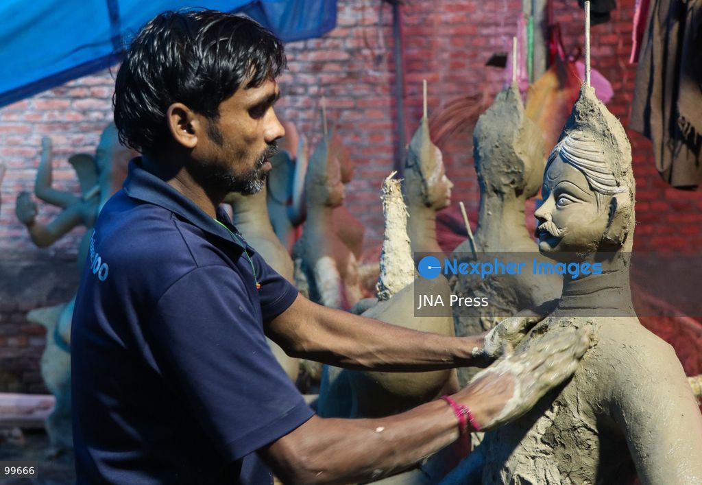 LALITPUR, NEPAL, SEPTEMBER 30, 2026: Sculptors work on clay idols of the Hindu goddess Durga in Lalitpur as preparations continue for the Dashain festival. Artisans shape the figures using clay, mud and straw ahead of celebrations for one of Nepal's most important Hindu festivals. Photo by Shankar Bhujel / JNA Press. (Photo by Shankar Bhujel/JNA Press via Nexpher Images)