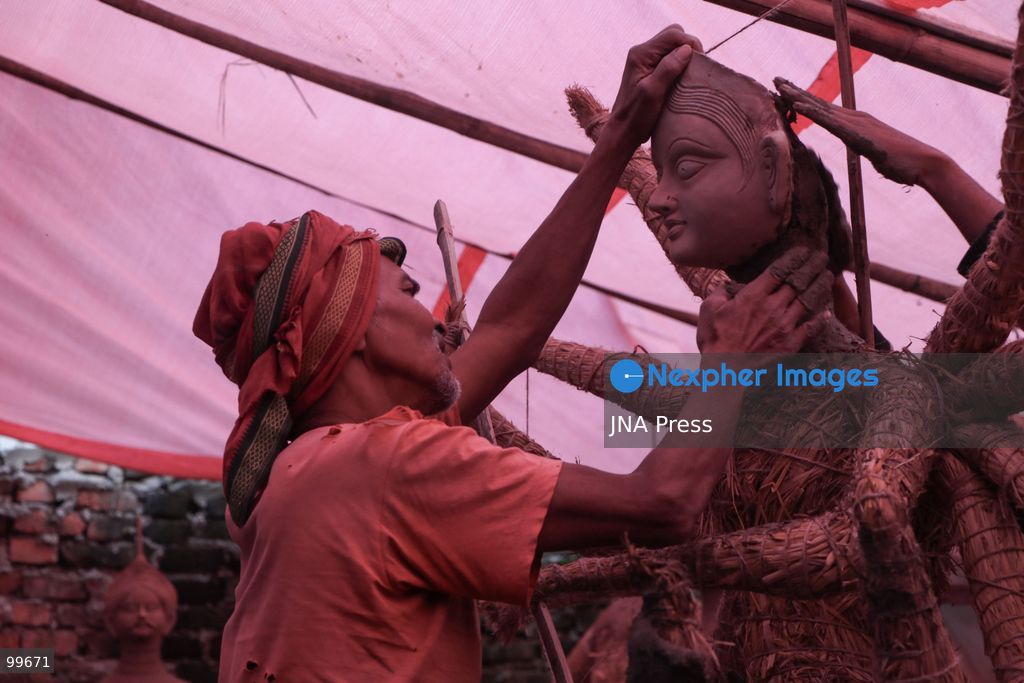 LALITPUR, NEPAL, SEPTEMBER 30, 2026: Sculptors work on clay idols of the Hindu goddess Durga in Lalitpur as preparations continue for the Dashain festival. Artisans shape the figures using clay, mud and straw ahead of celebrations for one of Nepal's most important Hindu festivals. Photo by Shankar Bhujel / JNA Press. (Photo by Shankar Bhujel/JNA Press via Nexpher Images)
