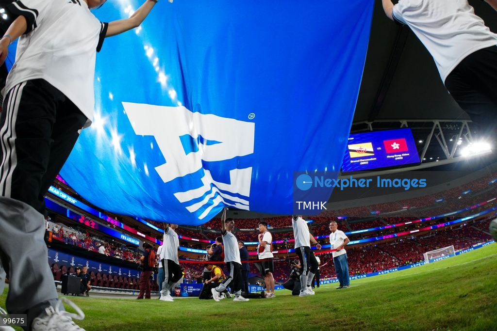 Flag bearers carry the official FIFA flag onto the pitch during the pre-match opening ceremony ahead of the FIFA ASEAN Cup Tier 2 encounter between Hong Kong, China and Brunei at Kai Tak Stadium on September 30, 2026 in Hong Kong. (Photo by Zulu Lo/TMHK via Nexpher Images)