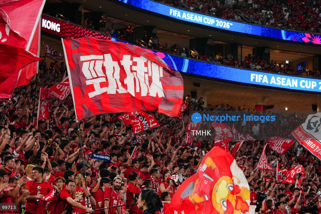 A crowd of over 20,000 spectators chant, wave red flags, and celebrate in the stands during Hong Kong, China's 2-0 victory over Brunei at the FIFA ASEAN Cup at Kai Tak Stadium on September 30, 2026 in Hong Kong. (Photo by Zulu Lo/TMHK via Nexpher Images)