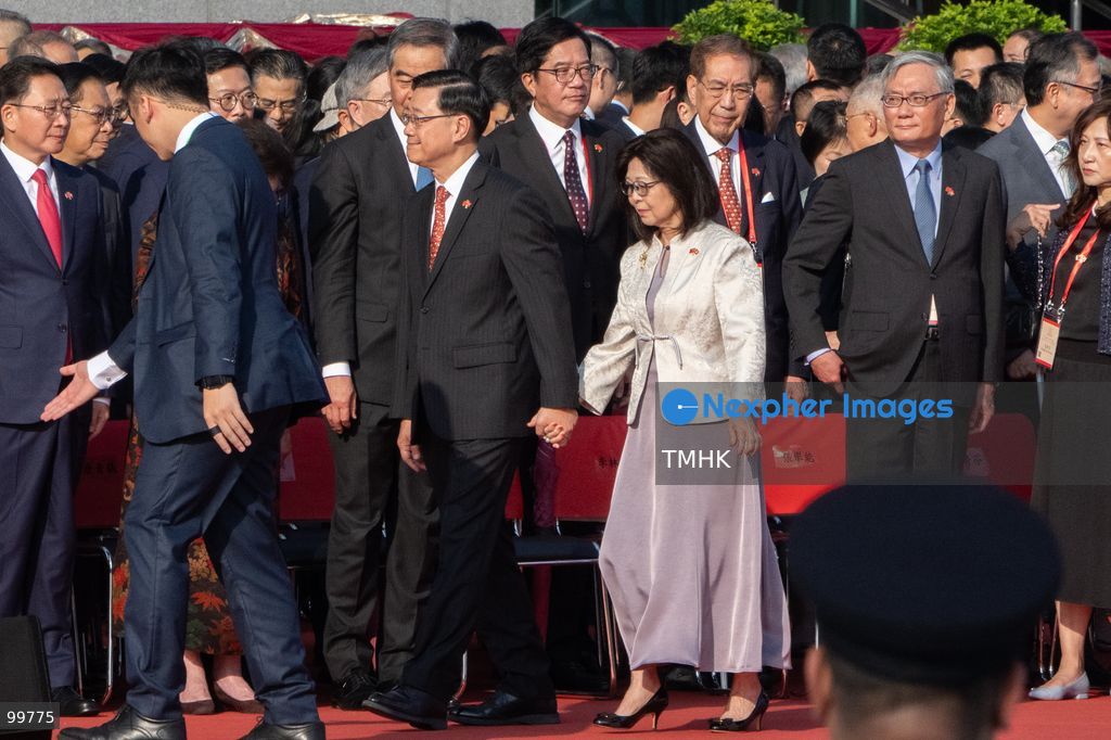 Hong Kong Chief Executive John Lee Ka-chiu and his wife, Janet Lam Lai-sim, depart Golden Bauhinia Square and walk toward the Grand Hall of the Hong Kong Convention and Exhibition Centre to host the official National Day reception on October 1, 2026 in Hong Kong. (Photo by Kevin Li/TMHK via Nexpher Images)
