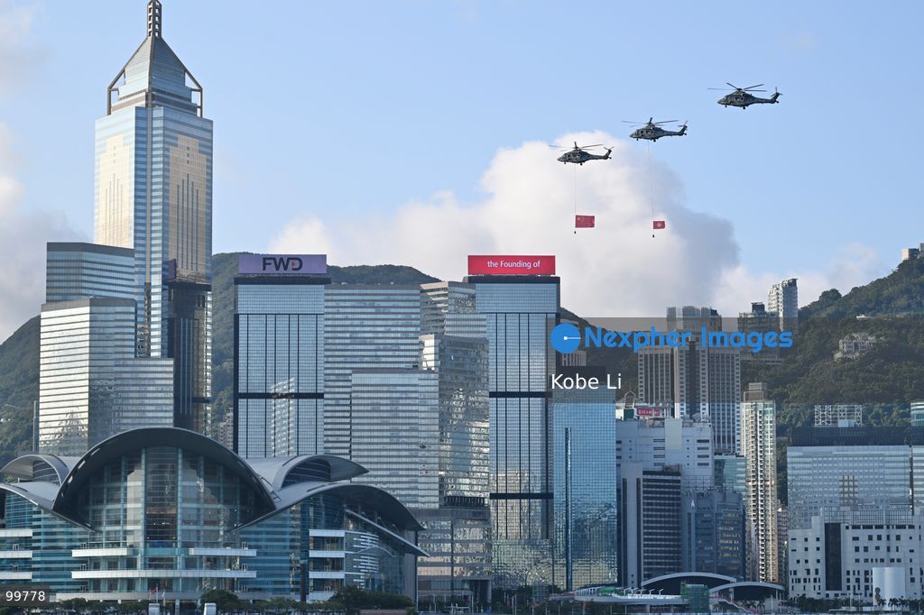 Helicopters carrying the national flag of China and regional flag of Hong Kong fly pass the flag raising ceremony on October 1, 2026 in Hong Kong. Today is the China's National Day. (Photo by Kobe Li/Nexpher Images)