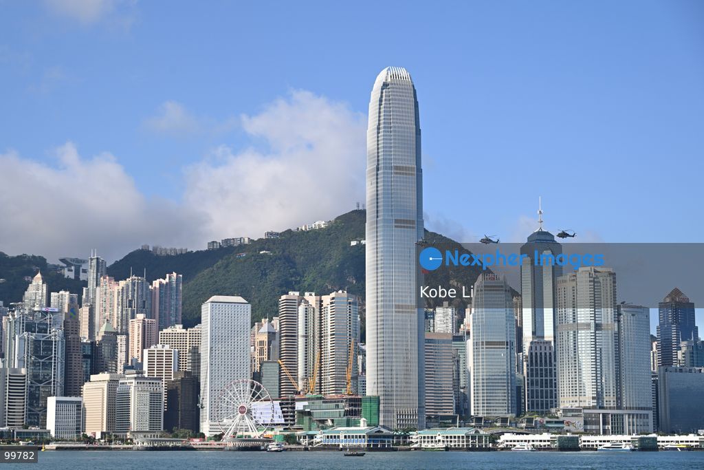 Helicopters carrying the national flag of China and regional flag of Hong Kong fly pass the flag raising ceremony on October 1, 2026 in Hong Kong. Today is the China's National Day. (Photo by Kobe Li/Nexpher Images)