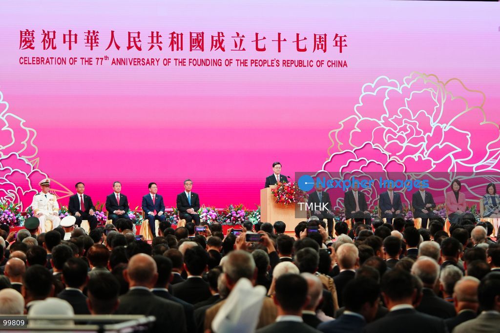 A general wide view shows Hong Kong Chief Executive John Lee Ka-chiu delivering his keynote speech from the podium during the 77th National Day reception in the Grand Hall of the Hong Kong Convention and Exhibition Centre on October 1, 2026 in Hong Kong. Lee highlighted the city's newly unveiled Five-Year Plan to unlock Hong Kong's overlapping advantages as a "super connector" and "super value-adder". (Photo by Zulu Lo/TMHK via Nexpher Images)