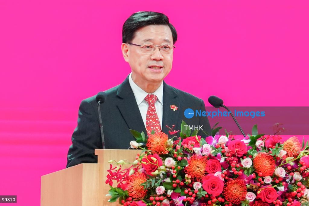 A close-up headshot captures Hong Kong Chief Executive John Lee Ka-chiu speaking at the podium during the official reception marking the 77th National Day of the People's Republic of China at the Hong Kong Convention and Exhibition Centre on October 1, 2026 in Hong Kong. (Photo by Zulu Lo/TMHK via Nexpher Images)