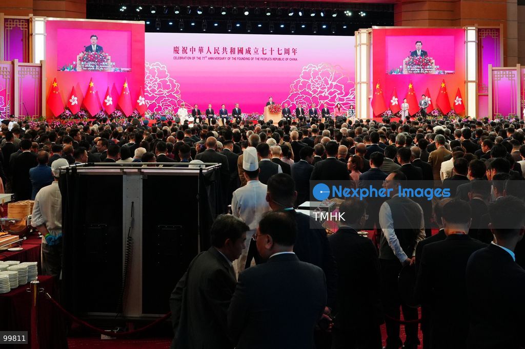 A general wide view shows Hong Kong Chief Executive John Lee Ka-chiu delivering his keynote speech from the podium during the 77th National Day reception in the Grand Hall of the Hong Kong Convention and Exhibition Centre on October 1, 2026 in Hong Kong. Lee highlighted the city's newly unveiled Five-Year Plan to unlock Hong Kong's overlapping advantages as a "super connector" and "super value-adder". (Photo by Zulu Lo/TMHK via Nexpher Images)