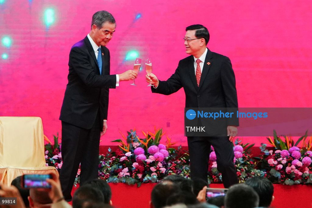 Hong Kong Chief Executive John Lee Ka-chiu clinks champagne glasses with Vice Chairman of the National Committee of the Chinese People's Political Consultative Conference (CPPCC) Leung Chun-ying on stage during the toast at the 77th National Day reception at the Hong Kong Convention and Exhibition Centre on October 1, 2026 in Hong Kong. (Photo by Zulu Lo/TMHK via Nexpher Images)