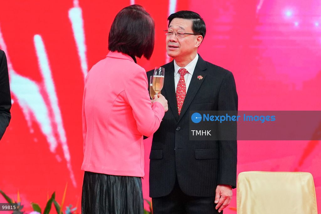 Hong Kong Chief Executive John Lee Ka-chiu clinks glasses with Legislative Council President Starry Lee Wai-king during the onstage toast at the National Day reception in the Grand Hall of the Hong Kong Convention and Exhibition Centre on October 1, 2026 in Hong Kong. (Photo by Zulu Lo/TMHK via Nexpher Images)