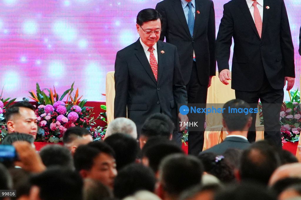 Hong Kong Chief Executive John Lee Ka-chiu steps down from the main stage following the ceremonial toast during the 77th National Day reception at the Hong Kong Convention and Exhibition Centre on October 1, 2026 in Hong Kong. (Photo by Zulu Lo/TMHK via Nexpher Images)