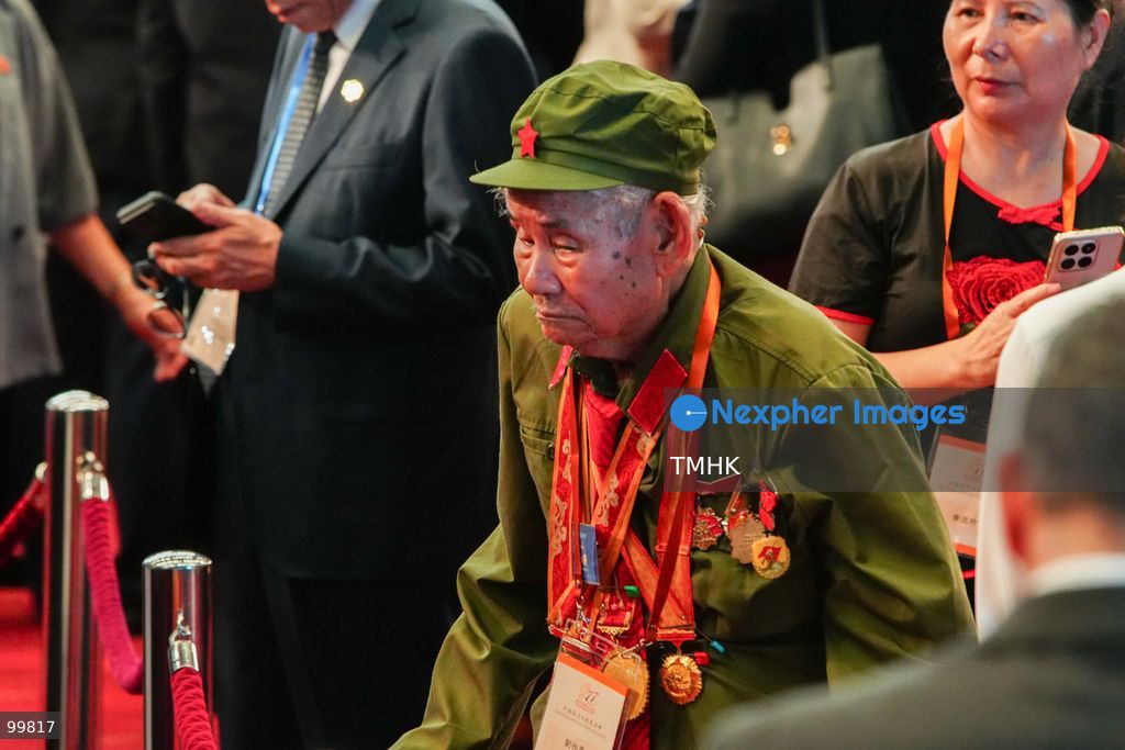 A veteran of the Chinese People's Liberation Army (PLA), wearing commemorative service medals, is seen among invited guests attending the 77th National Day reception in the Grand Hall of the Hong Kong Convention and Exhibition Centre on October 1, 2026 in Hong Kong. (Photo by Zulu Lo/TMHK via Nexpher Images)