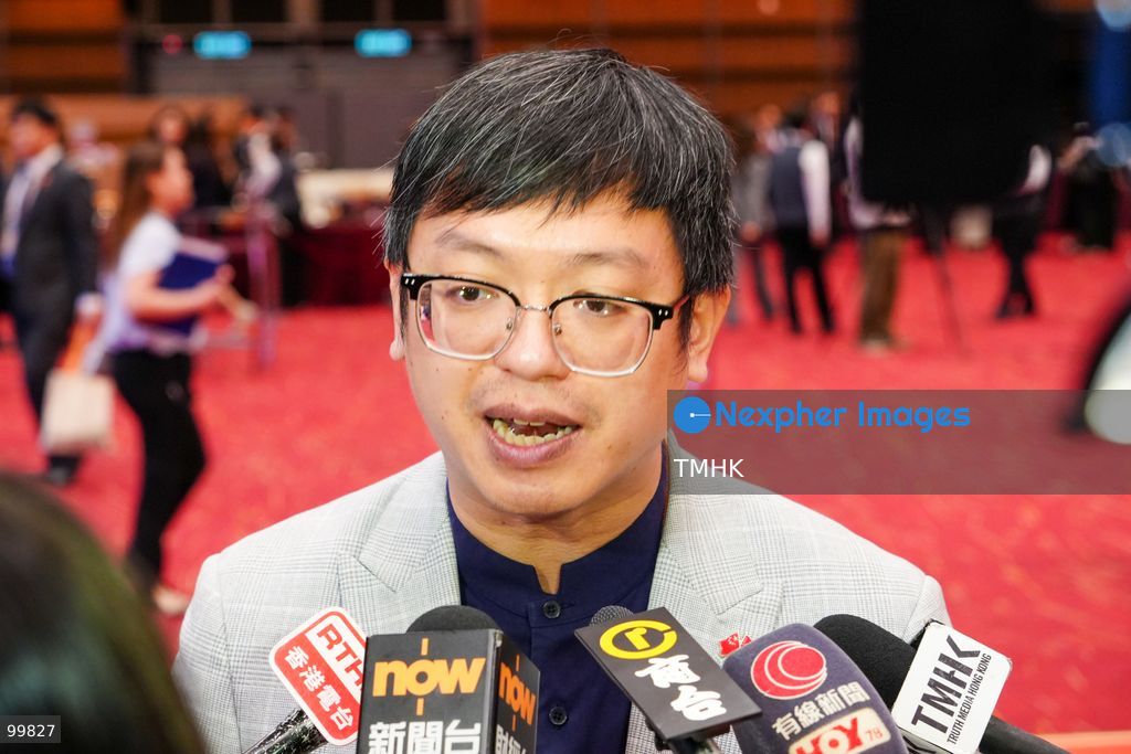 Under Secretary for Labour and Welfare Ho Kai-ming speaks to reporters and answers questions outside the Grand Hall of the Hong Kong Convention and Exhibition Centre following the official 77th National Day reception on October 1, 2026 in Hong Kong. (Photo by Zulu Lo/TMHK via Nexpher Images)