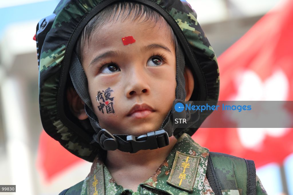 A child wearing Chinese military uniform on October 1, 2026 in Hong Kong. Today is the China's National Day. (Photo by STR/Nexpher Images)