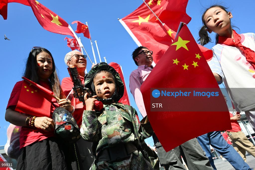 A child wearing Chinese military uniform, holding a national flag of China and a toy gun on October 1, 2026 in Hong Kong. Today is the China's National Day. (Photo by STR/Nexpher Images)