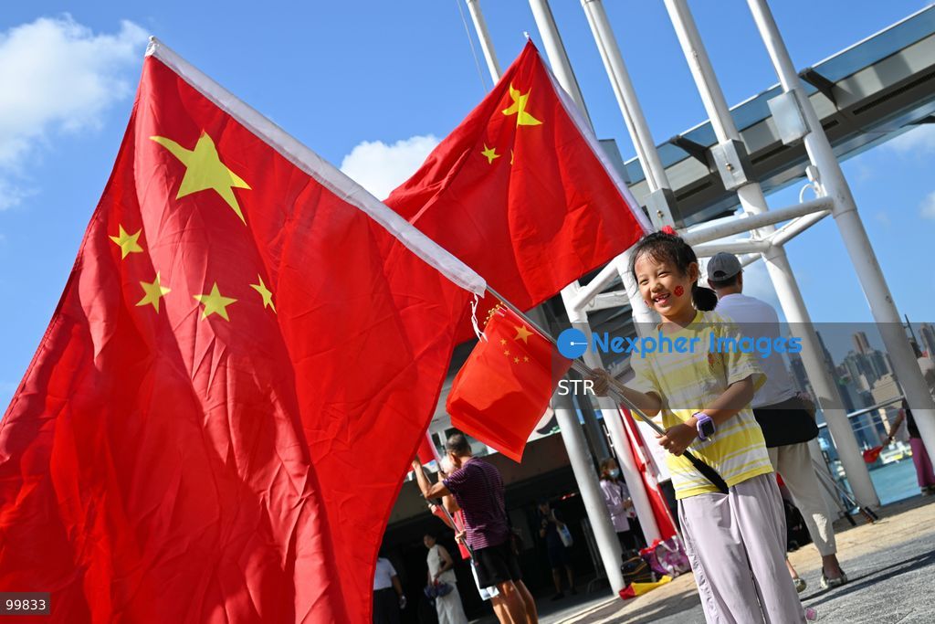 A child holding a national flag of China on October 1, 2026 in Hong Kong. Today is the China's National Day. (Photo by STR/Nexpher Images)