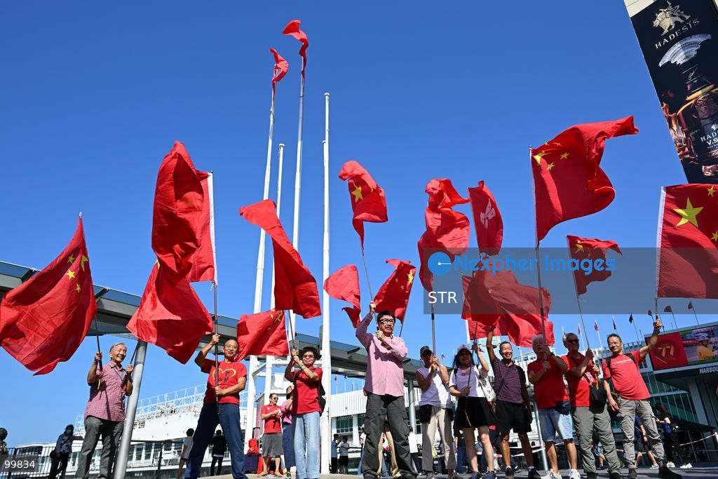 People holding a national flag of China on October 1, 2026 in Hong Kong. Today is the China's National Day. (Photo by STR/Nexpher Images)