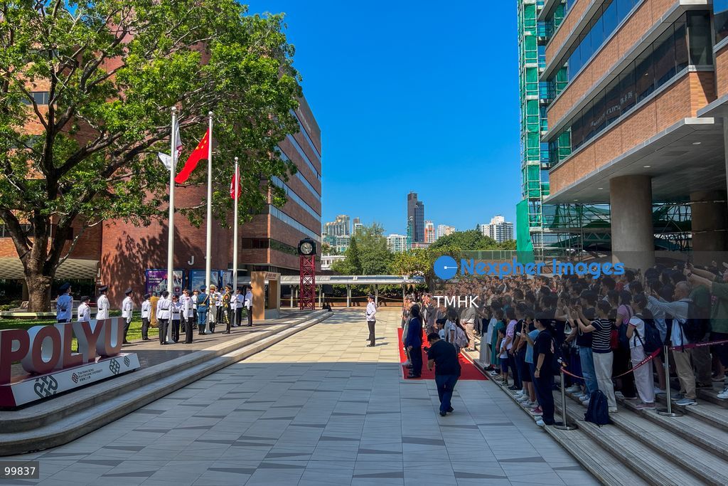 A general wide view shows guests, university leadership, and the flag-raising teams standing assembled on the podium following the successful conclusion of the 77th National Day flag-raising ceremony at The Hong Kong Polytechnic University on October 1, 2026 in Hong Kong. (Photo by Peter Tsang/TMHK via Nexpher Images)