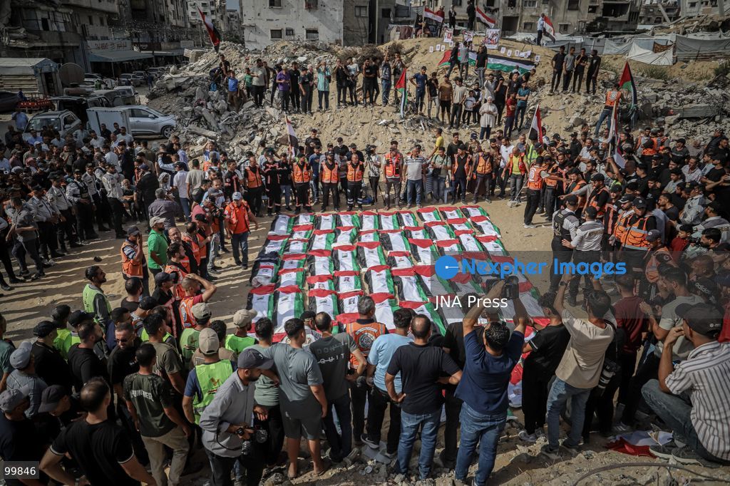 GAZA CITY, GAZA STRIP, OCTOBER 1, 2026: Palestinian families bid farewell to the remains of 105 Palestinians whose bodies were recovered from beneath the rubble of the Al-Taj residential area in Gaza City. The victims were killed in Israeli airstrikes on October 25, 2023, when residential buildings in the Yarmouk area were destroyed. Gaza Civil Defense teams recovered the bodies and remains after a 17-day search operation carried out in coordination with an Egyptian committee. Families gathered to identify their relatives and pay their final respects before burial. Photo by Mohammed M. Skaik / JNA Press. (Photo by Mohammed M Skaik/JNA Press via Nexpher Images)
