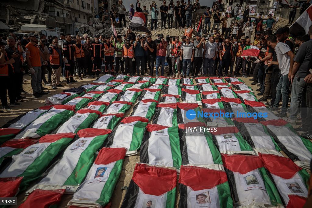 GAZA CITY, GAZA STRIP, OCTOBER 1, 2026: Palestinian families bid farewell to the remains of 105 Palestinians whose bodies were recovered from beneath the rubble of the Al-Taj residential area in Gaza City. The victims were killed in Israeli airstrikes on October 25, 2023, when residential buildings in the Yarmouk area were destroyed. Gaza Civil Defense teams recovered the bodies and remains after a 17-day search operation carried out in coordination with an Egyptian committee. Families gathered to identify their relatives and pay their final respects before burial. Photo by Mohammed M. Skaik / JNA Press. (Photo by Mohammed M Skaik/JNA Press via Nexpher Images)