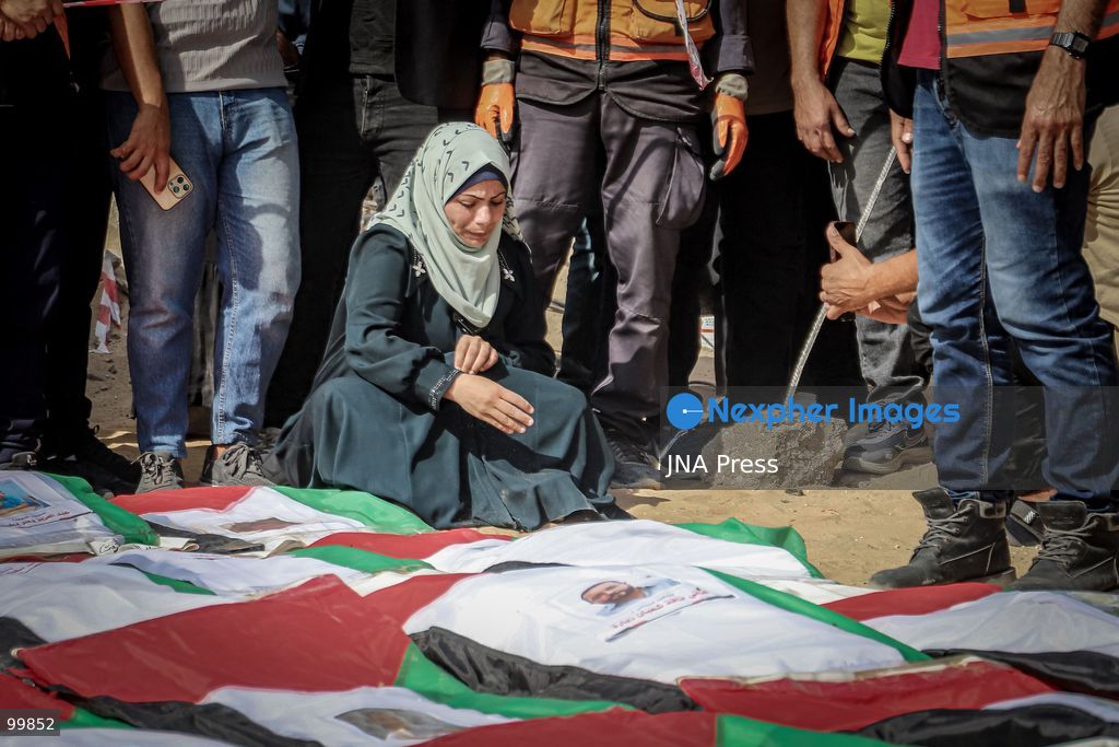 GAZA CITY, GAZA STRIP, OCTOBER 1, 2026: Palestinian families bid farewell to the remains of 105 Palestinians whose bodies were recovered from beneath the rubble of the Al-Taj residential area in Gaza City. The victims were killed in Israeli airstrikes on October 25, 2023, when residential buildings in the Yarmouk area were destroyed. Gaza Civil Defense teams recovered the bodies and remains after a 17-day search operation carried out in coordination with an Egyptian committee. Families gathered to identify their relatives and pay their final respects before burial. Photo by Mohammed M. Skaik / JNA Press. (Photo by Mohammed M Skaik/JNA Press via Nexpher Images)