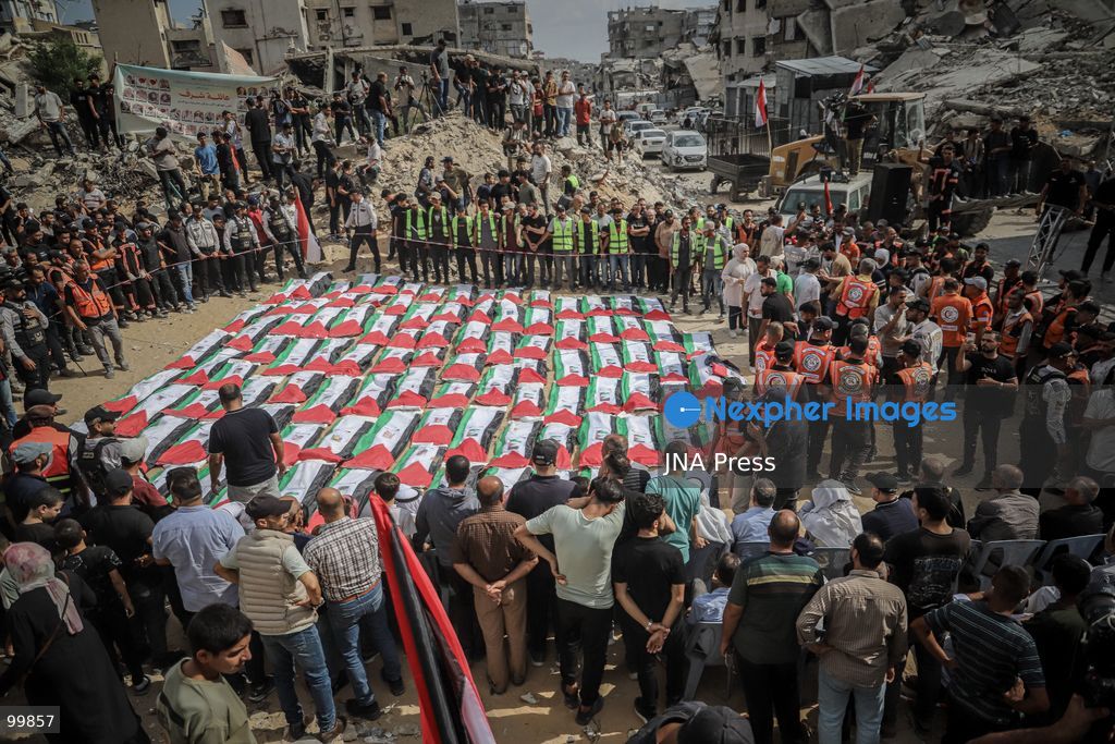 GAZA CITY, GAZA STRIP, OCTOBER 1, 2026: Palestinian families bid farewell to the remains of 105 Palestinians whose bodies were recovered from beneath the rubble of the Al-Taj residential area in Gaza City. The victims were killed in Israeli airstrikes on October 25, 2023, when residential buildings in the Yarmouk area were destroyed. Gaza Civil Defense teams recovered the bodies and remains after a 17-day search operation carried out in coordination with an Egyptian committee. Families gathered to identify their relatives and pay their final respects before burial. Photo by Mohammed M. Skaik / JNA Press. (Photo by Mohammed M Skaik/JNA Press via Nexpher Images)